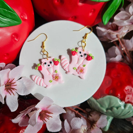 Raccoons holding Strawberry & Sakura