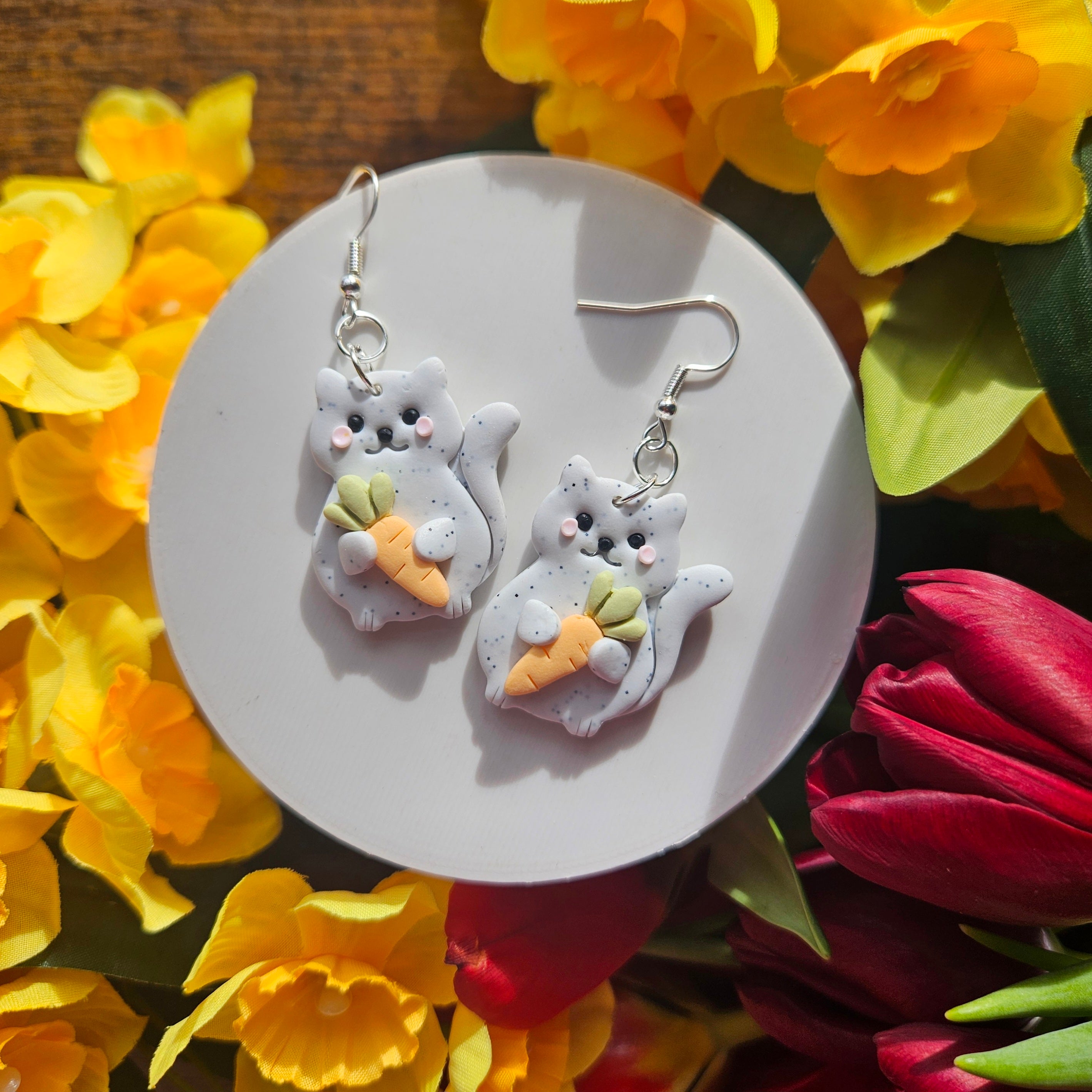 Fat Cat Holding Carrots